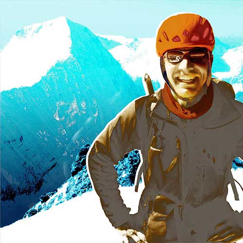 Portrait of climber reaching the summit of the Eiger.